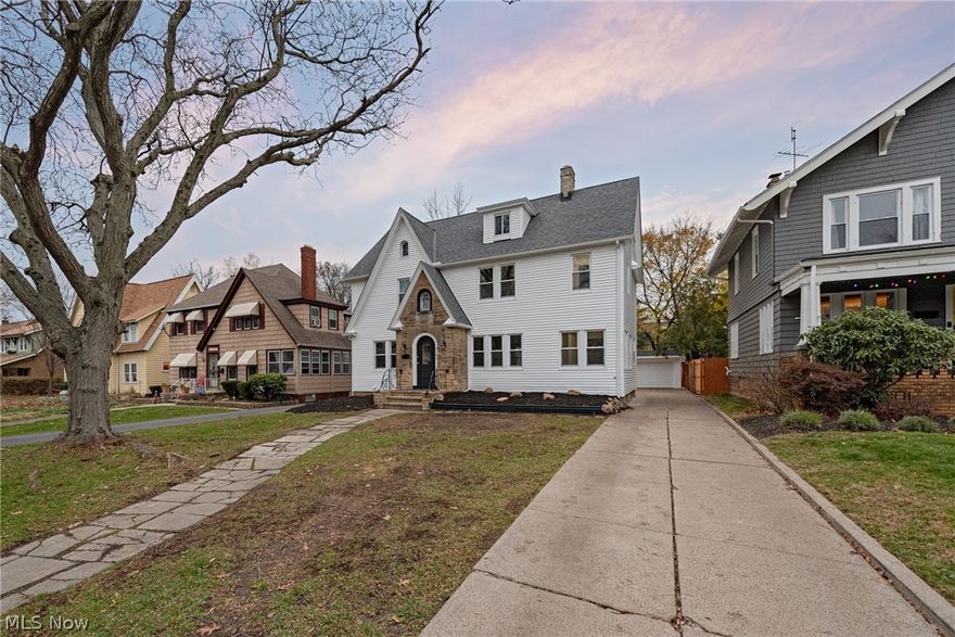 Welcome home to this elegantly renovated center hall colonial in the heart of Cleveland Heights! This delightful home provides the perfect blend of historic charm and modern amenities, including gorgeous hardwood floors, a stunning kitchen, and luxurious bathrooms. Beautifully refinished hardwood floors greet you as you step out of the foyer to find the living room on your right and the formal dining room on your left. You will absolutely love the open kitchen, which includes granite counters, crisp white cabinetry, stainless steel appliances, and an oversized island with a breakfast bar. Off of the living room, you will find a sunroom and a bonus space that is perfect for a home office! On the second floor, there are three bedrooms and three full bathrooms with elegant finishes. Plus, there is a convenient laundry area on the second floor! The third floor includes another bedroom suite with an ensuite bathroom with a quartz vanity and a step-in shower with gorgeous tile surround. The