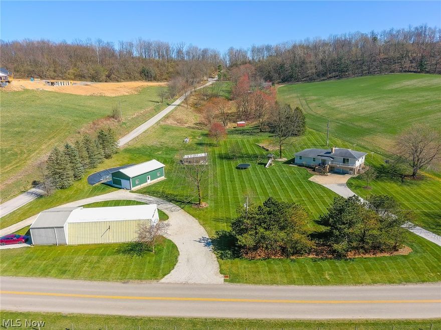 What an opportunity to own a spacious 4.55-acre property in a desirable location between Baltic & Sugarcreek! This property has been meticulously cared for and updated over the last few years. As you enter the driveway, you are welcomed by a 3-bed, 2-bath, split level ranch as well as two other outbuildings. A 30’x 80’ shop and 20’ x 40’ barn outfitted as a dog kennel offers opportunity and complement the layout of the property. The home offers a beautifully updated main floor that includes a stunning eat-in kitchen with custom cabinetry. The walkout basement has a full kitchen perfect for canning and prepping. If you are looking for an updated home with plenty of property for pasture and animals that overlooks a beautiful valley, this one is for you!