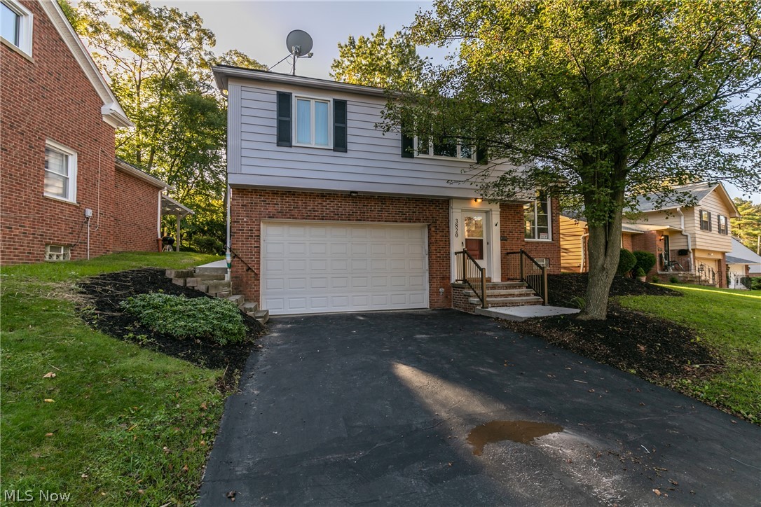 Welcome to this stunning split level in University Heights! The living room has a large front window to allow natural light to shine on the beautiful flooring throughout the home. The living room opens up to the dining, kitchen area that has all been updated. The kitchen has new white cupboards that accent the quartz countertops, subway tile and stainless steel appliances. The kitchen also boasts a beautiful wood accent wall! A three season room off the kitchen is the perfect area to sip coffee in during these cool fall mornings. Three nicely sized bedrooms, and the master has attached an updated bathroom. Downstairs has a partially finished basement that could be turned into a rec room. Check this one out today because it won't last!