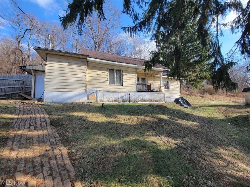 Welcome to Sunset Heights.  2 bedroom ranch w/ Land.  Priced to sell.  Large Oversized garage with a  work area and car lift to service vehicles.