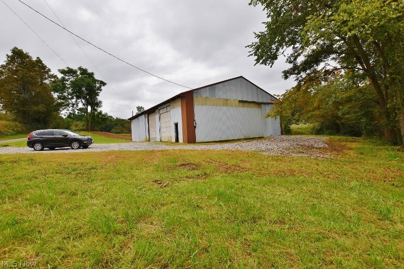 Nice opportunity to own 3 acres with a 50x80 pole building offering great visibility on St Rt 212 and only .4 miles west of Atwood Dam. Approximately 1.5 miles to Atwood Lake Marina West. Plenty of area for a home site if desired. The building has brand new concrete and a drain in the floor. The property has been cleaned up and mowed. The building has 4, 12' wide doors. Two are overhead and two are sliding. All doors are either 12 ' high or 14' high. 14' 6" high ceilings. The building also has a 220 electric panel in place and a meter box as well. Perfect set up for boat & camper storage or someone just needing a good building to store their own items. There is no well or sewer hook ups on the property at this time. So many options with this great opportunity.