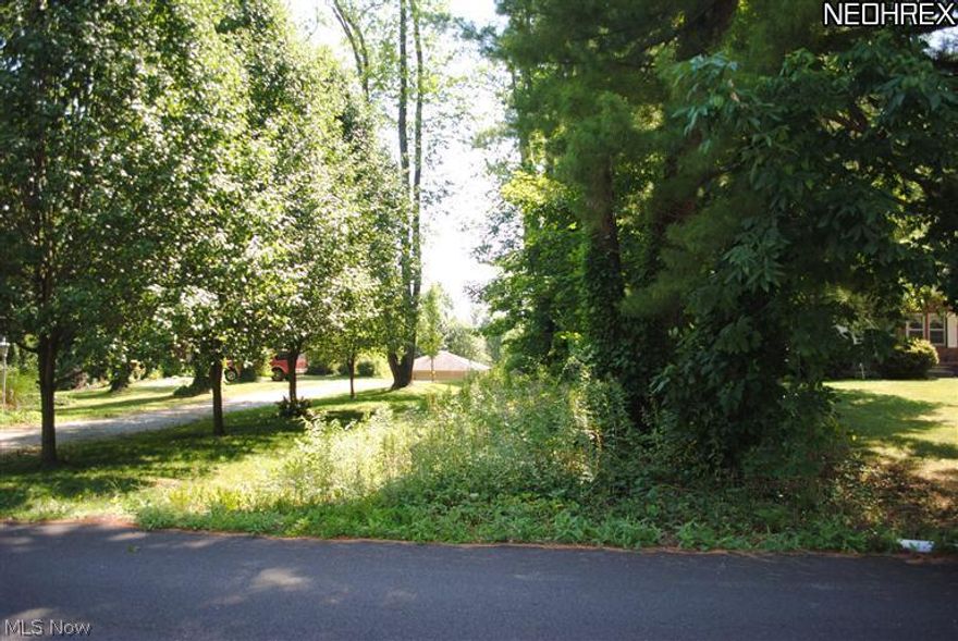 BANK OWNED .... Vacant Residential Lot .... Very Desirable Area .... 1.4 Acres Of Wooded Lot ....