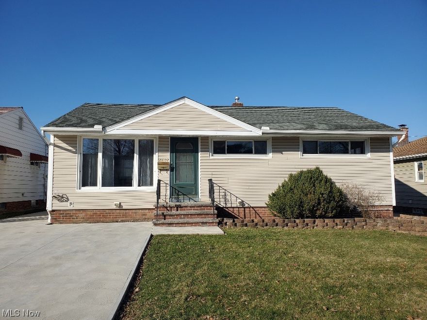 Welcome to this meticulously maintained 3-bedroom, 2-bathroom ranch-style home, offering convenient first-floor living. Step into a custom-designed kitchen equipped with all appliances, complemented by a charming eat-in area perfect for casual dining. The spacious, sunlit living room boasts gleaming hardwood floors, ideal for relaxation and entertainment. This residence features generously sized bedrooms for comfort and versatility. Descend to the partially finished basement with a decorative bar, where a stunning modern full bathroom awaits, adding both functionality and style to the space. Outside, discover additional parking in the front, along with an expansive extended parking area in the rear, complete with a patio for outdoor gatherings. The property is partially fenced and includes a two-car garage, providing ample storage and convenience. Situated close to walking trails, shopping destinations, and major highways, this home offers both serenity and accessibility for modern living.