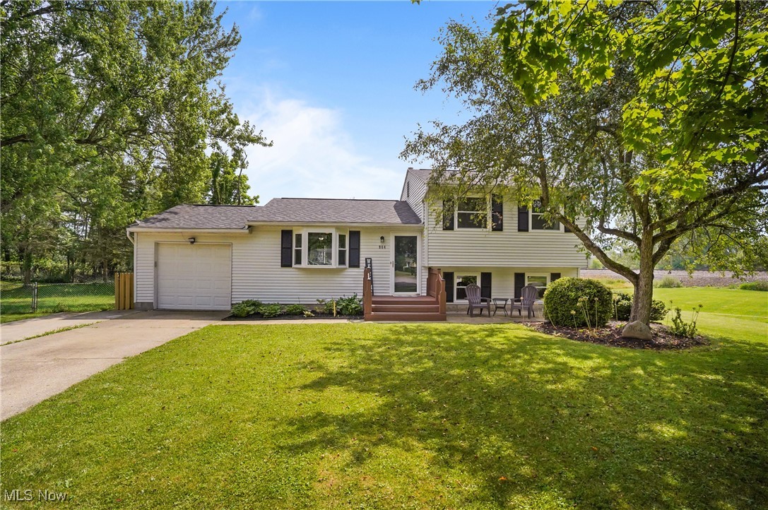 Welcome home to this charming 3-bedroom, 1.5-bath split-level nestled in a convenient neighborhood within the Kent City School District. Thoughtfully designed for both comfort and functionality, this home features two inviting living spaces—a spacious main-level living room and a cozy lower-level family room with a wood-burning fireplace, perfect for relaxing or entertaining. Upstairs, you'll find all three freshly carpeted bedrooms and an updated full bath, offering a practical and private layout. The beautifully updated kitchen, renovated in 2020, showcases stainless steel appliances and ceramic tile flooring. It opens to the dining room, where sliding glass doors lead to a rear deck and a fully fenced backyard—complete with a firepit and storage shed—ideal for outdoor living, summer BBQs, and keeping pets or children safely contained. Recent Updates Include: Kitchen renovation '20,
Laminate flooring '20, Hot water heater '20, windows '22, Roof replacement '23, Front deck '25, lighting, ceiling fans and freshly painted through out. Additional highlights include a one-car attached garage and an extended driveway with a parking pad for extra vehicles. This well-maintained home offers the perfect blend of charm, space, and location—just minutes from Stow as well as downtown Kent’s shopping, restaurants, and community festivals.