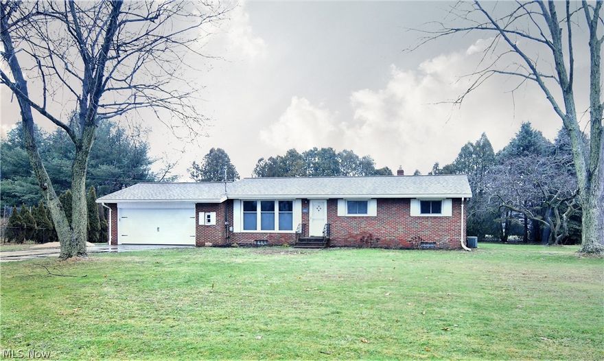Well maintained brick ranch near Turkeyfoot Lake. Many updates and a large tiled sun room including a woodburning stove. Beautiful hardwood floors, newer windows, concrete, roof (2015), bedroom carpet. Full basement with finished area bar and storage galore. This lovely home is move-in ready.