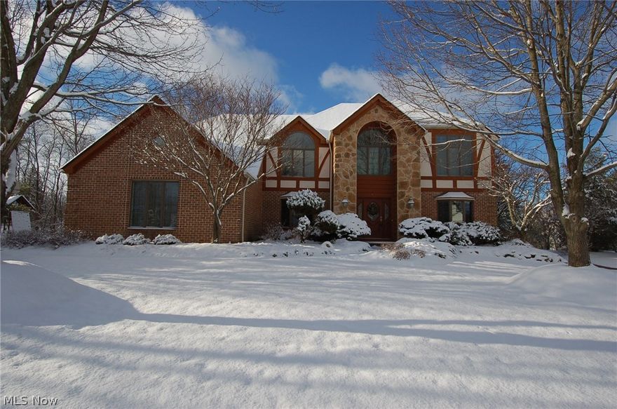 Welcome home to one of Strongsville’s most desired neighborhoods! This custom built home features everything you could dream of! Traditional Colonial is very spacious featuring four large bedrooms plus an office and a separate suite in the basement! Very large kitchen features a large island, ample cabinets and counter space, an amazing built-in pantry, and newly installed ceramic tile flooring (2016). Kitchen is open to large two-story family room.  Family room features a beautiful fireplace and a private wet bar. Owner’s retreat features a huge bedroom with vaulted ceiling, enormous bathroom featuring a jetted soaking tub, separate shower, separate vanities and sinks, private toilet room, and two huge closets. The owner’s retreat features a large sitting room with private fireplace and double doors that open to overlook the two-story family room. Let’s not forget the finished basement! The walk-out basement was custom designed for a home business. This area offers an office or bedroo