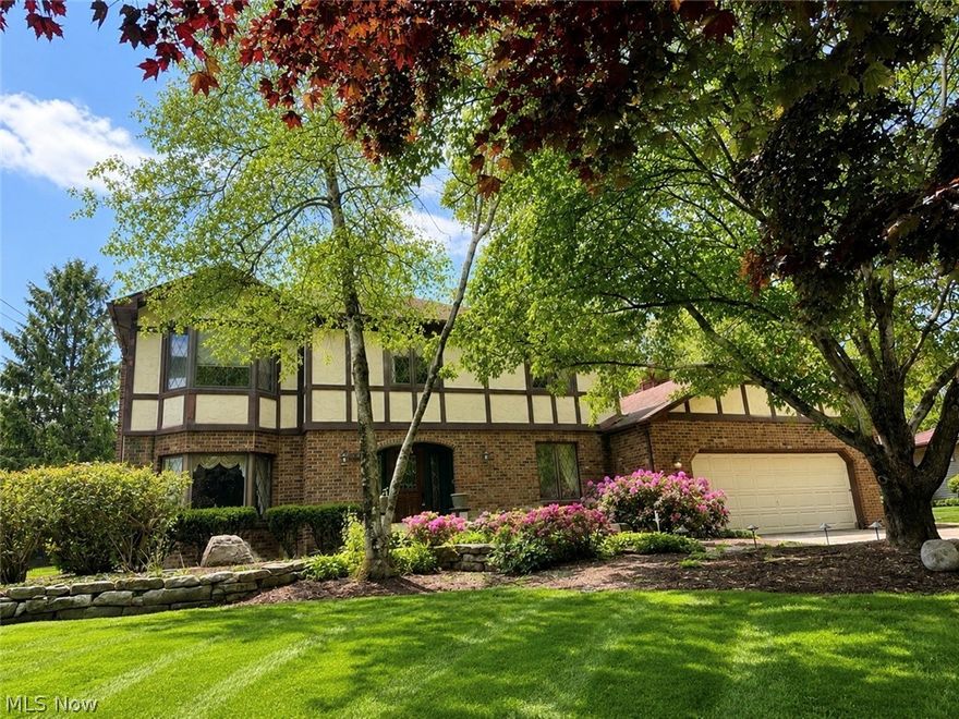 Back on the market with fresh updates including new carpet and paint throughout! Move right in! Proudly presenting this extraordinary custom-built residence-meticulously crafted over seven years and impeccably maintained by its original owner. A rare opportunity to own a home with such enduring quality, ideally situated on private, wooded grounds within the highly acclaimed Canfield Local School District.
A grand foyer welcomes you with elegant leaded-glass sidelights, rich solid oak doors and trim, graceful arched openings, and a striking custom spiral staircase-an immediate statement of the artistry poured into every detail.
The main level showcases an expansive great room anchored by a beautiful fireplace, a fully appointed kitchen with custom cabinetry, and a charming breakfast nook with sliding glass doors opening to the rear porch. A formal dining room sets the stage for memorable gatherings, while the distinguished library-complete with bespoke built-ins and a sunlit bay window-offers an inviting retreat for work or relaxation. The Florida room provides sweeping views of the serene, wooded backdrop and is beautifully framed by a brand-new wrought iron fence, with additional garden space extending beyond the fenced grounds.
Upstairs, three large bedrooms provide exceptional versatility. The front bedroom features a bay window, while a secondary bedroom includes both an in-room closet and a full walk-in closet. The luxurious primary suite is highlighted by a spa-inspired bath with jacuzzi tub and a custom-designed walk-in closet.
Automotive enthusiasts and hobbyists will appreciate the heated attached garage with direct basement access, dedicated workshop nook, and an additional storage shed.
Thoughtful amenities continue throughout the home, including a full-size laundry room with convenient laundry chutes, whole-house water softener, security system, Pella windows, custom hardware, and a sprawling lower level ready to be finished.