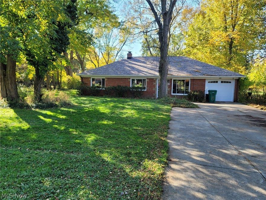 The perfect 3-bedroom, 2 full bathroom solid brick ranch nestled on a 1-acre park-like lot in Richmond Heights! Featuring a spacious kitchen with stainless steel appliances that opens into the dining room and family room with extra-large picture window!  Updated luxury vinyl flooring throughout the entire home!  Both full bathrooms have been remodeled and the 3-seasons room has been completely updated as well!  Enjoy the views of this private gorgeously wooded backyard!  Schedule your showing today!