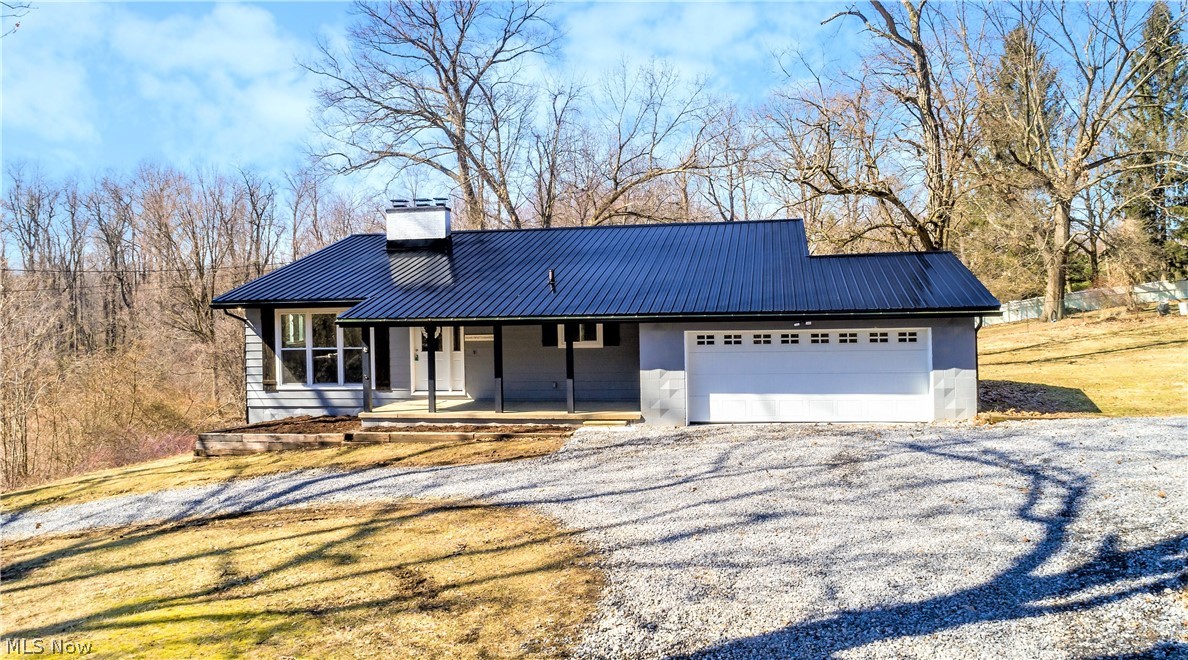 * Updated And MODERN Remodeled In Green, This Farmhouse Style Home Features 4 Bdrms, 2.5 Baths, 2200 Sq. Ft Including A FINISHED Walkout Lower Level, 2 Car Attached Garage, Wrap Around 2 Entrance/Exit Driveway With Extra Side Parking & 1/2 An Acre! *Relax And Listen To Birds & Sounds Of Nature While On The New 350 Sq. Ft Back DECK OR The Front COVERED PORCH! It Really Is So Peaceful Living On A No Outlet Street W/Trees & Fields On One Side As Far As The Eye Can See! *NEW Metal ROOF, Dark Gray Painted Vinyl/Brick Exterior, Gutters, Downspouts & Garage Door *Add.-> Updates Include: Complete New HVAC System -FURNACE, AC, ELECTRIC Panel, H20 Tank, WINDOWS *Kitchen W/New White Shaker Style CNC Cabinets & Island, SPARKLE White Galaxy GRANITE COUNTERTOPS, High End LUXURY Plank Flooring, SS Whirlpool Dishwasher, Stove & Hood, SS Undermount Sink, Pendant Lighting & Glass Tile Backsplash *Refinished Hardwood Floors, White Washed Fireplace, SHIPLAP Walls, White Stairway W/Black Spindles - OPEN Co