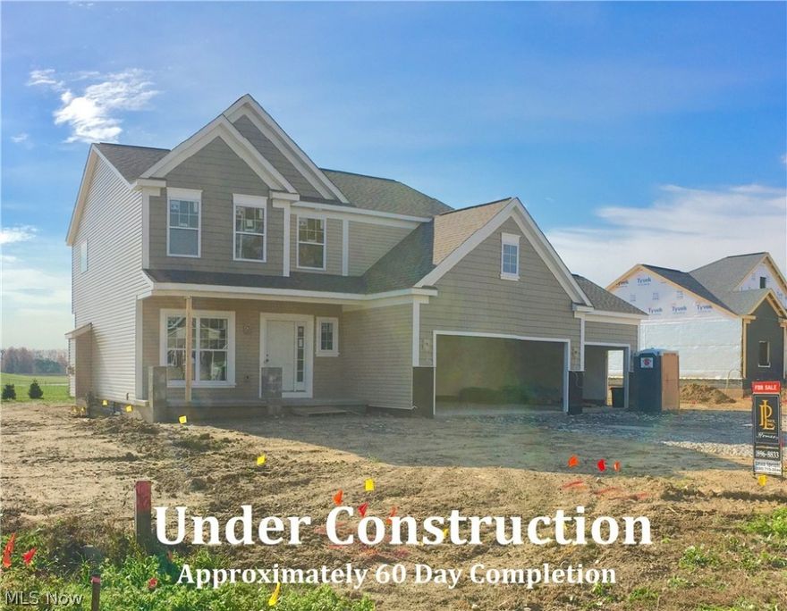 Augusta II Plan with extended 4 car garage. Custom built by Patrick Long Homes.