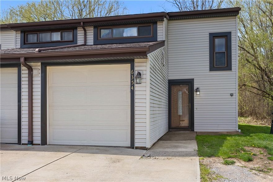 A rare opportunity to get into North Ridgeville for well under 200k with this THREE bedrooms and TWO FULL bath condo! (One on full bath on each level). First floor laundry. This END UNIT has an open grassy common area to the one side! Step inside to LVP wood flooring on the main level. Updated kitchen with solid surface countertops and a large breakfast nook. All appliances remain including the washer and dryer. Walk in showers in both bathrooms with custom tilework throughout! Spacious primary bedroom with double closet. Rear patio overlooks the treeline. Attached garage is great for storage. The home does has the air ducting for central air conditioning present, however the exterior a/c unit will need replaced and reconnected.  Located just down the street from the North Ridgeville Academic campus and several restaurants and daily conveniences.