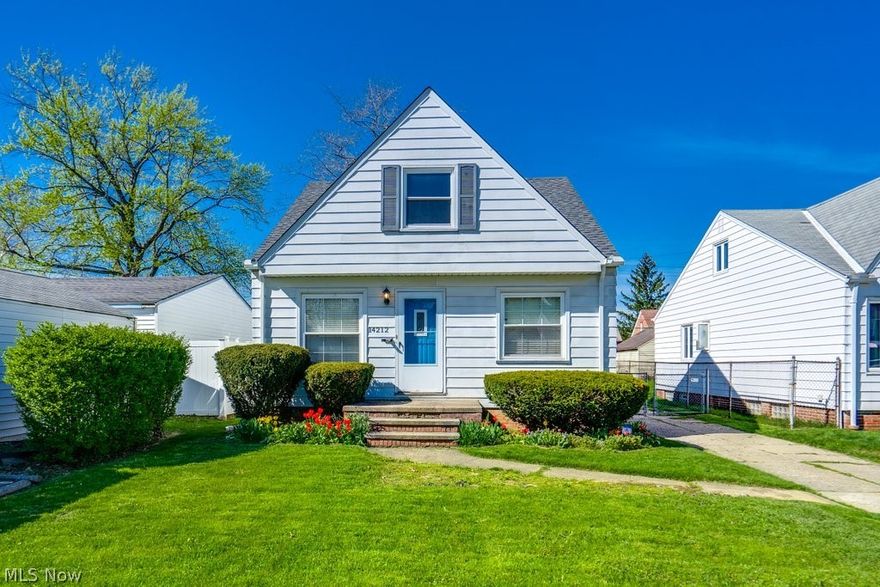 Welcome to this enchanting Cape Cod home, nestled in a delightful Cleveland neighborhood, where classic charm meets modern updates. As you step inside, you'll immediately be greeted by the warm glow of original wood flooring, which extends throughout the main level, adding an air of historic elegance to this cozy retreat. The heart of the home is the eat-in kitchen, a bright and inviting space featuring pristine white cabinets that contrast beautifully with the sleek new flooring. It's the perfect spot for morning coffee or gathering for a meal, with plenty of natural light streaming through the windows. Comfort and convenience blend seamlessly in the updated main-level bathroom, complete with a modern walk-in shower, ideal for accessibility and ease. The two bedrooms on this floor offer quiet havens for rest and relaxation, each adorned with the timeless touch of the original wood floors. Venture upstairs to discover a spacious, multi-functional area that presents endless possibilities. This large room includes a charming smaller separate area, ideal for a home office, craft nook, or reading room, providing a private escape from the daily hustle and bustle. The unfinished basement offers a blank canvas for creating additional living space, a workshop, or simply used for storage, tailored to your needs and imagination. Step outside to the quaint backyard, where a charming patio awaits to host your summer barbecues and family gatherings. This home not only captures the essence of traditional Cape Cod architecture but also embraces the comforts of modern living, making it a perfect blend of old and new. Updates include: new roof in October 2023, central AC installed, full bathroom remodel and more! Ready to move in and make your own, this property awaits its next chapter with you!