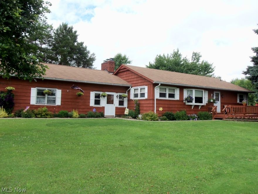 Mr. and Mrs. Clean live and maintain this immaculate home, inside and out!  Larger than appears Cedar sided Ranch with eat-in kitchen featuring Corian counters and beautiful custom Hickory Kitchen from Shawnee Wood Products!  Spacious 1st floor family room with brick wood burning fireplace, built-ins and accent lighting.  Large living room and bedrooms feature wood floors under the carpet. Walk out basement with full bath would be perfect for game room, man or woman cave, hobbyist, computer/media room, you decide.  Updates include 1st floor bath, new hot water boiler and hot water tank in Fall of 2013 when gas became available (stubbed lines in basement for dryer and stove), windows and outside stain.  Beautifully landscaped and plenty of room for any critter you may want. 30x40 pole barn with 3 - 4 year old roof, electric and concrete. Hydrant is in,  and water line is run to house, but never hooked up.  Paved horse shoe drive.