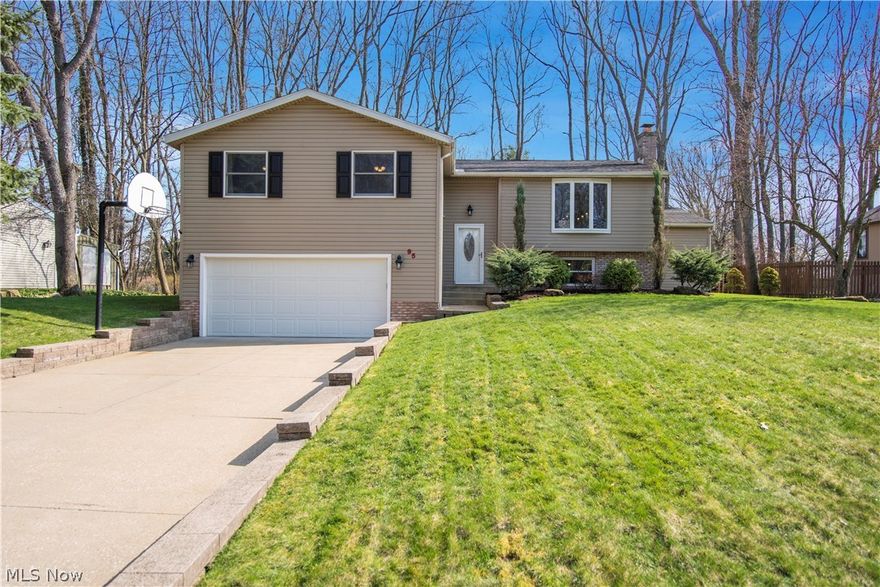 This is the home you have been waiting for - a phenomenal find!  Meticulously updated, maintained and spotless 4 bedroom home with 3 full baths (all updated)!  Spacious living/dining area with hardwood floors.  The updated kitchen offers plenty of cabinets and drawers with pull out pantry, granite counters, SS appliances & breakfast bar.  Sliders off kitchen/dining area lead you to a huge deck to enjoy the warm weather, hot tub, & fenced in, flat backyard.  Stone patio and brick fire pit area complete w/ underground cable, electric and refrigerator!  Master bedroom features a huge walk-in closet with organizers & beautifully updated bath with walk-in shower.  All bedrooms offer nice closet space. Bonus room is is currently used as a gaming room.  Relax and watch TV while soaking in your jetted tub in another updated bath.  The lower level is fantastic offering a perfect space for entertaining -- rec room with fireplace, incredible bar with sink and built in wine rack.  Just a few steps