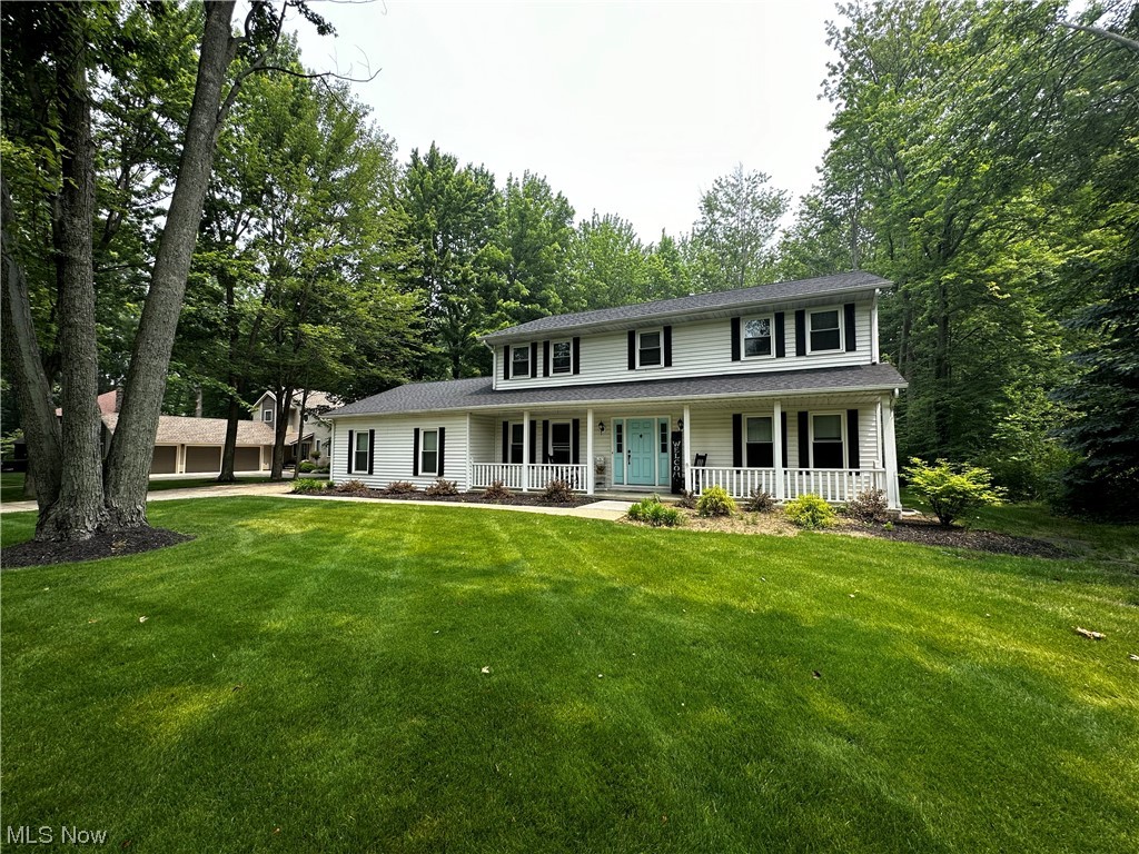 Step into this exquisite colonial that has undergone a complete transformation, situated on an 1-acre lot resembling a picturesque park. As you approach the residence, you are immediately greeted by a grand 30-foot covered front porch that exudes a warm and inviting ambiance.
The open eat-in kitchen is boasting shaker cabinets, subway-tiled backsplash, granite countertops, and a huge bay window that bathes the room in natural light. Adjoining seamlessly, the kitchen effortlessly flows into the great room, featuring a striking floor-to-ceiling brick woodburning fireplace and a newly installed sliding glass door that connects the interior space to the outdoors. Gracing the first floor, you will find a versatile office or living room adorned with exquisite french doors, as well as a formal dining room that sets the stage for memorable gatherings. Retreat to the generously sized master suite, equipped with a sprawling walk-in closet and an impeccably updated master bath boasting a cerami