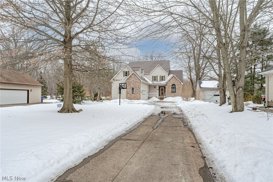 Wow! Move right into this stunning colonial in North Olmsted! This very spacious home features over 4000 square feet of finished living space with features including a luxurious owner's suite, a beautifully renovated kitchen, and a stunning great room with a cathedral ceiling. The front door opens into a welcoming foyer with wood floors that flow into the dining area on you right. The dining room is open to the sun-filled great room that features a gas fireplace and newer carpeting. You will love the recently-renovated kitchen that features granite countertops, a trendy backsplash, stainless steel appliances, and a sliding door to the back deck. Head back to the owner's suit that also features a cathedral ceiling, as well as an ensuite full bath with a soaking tub, updated fixtures, and a generous walk-in closet. Plus, the owner's suite also opens out to the back deck. A half bath near the kitchen completes the main floor. Upstairs, you will find three large bedrooms as well as a Jack & Jill full bath. The lower level includes a massive rec room, two bonus rooms, and a third full bathroom. Plus there is a laundry area and second egress to the attached garage. Outside, there is a large back deck with two covered areas, an above ground pool, and a very deep back yard that backs up to Bradley Woods Reservation. Conveniently located just minutes away from highway access and several shopping areas. Don't miss this one!