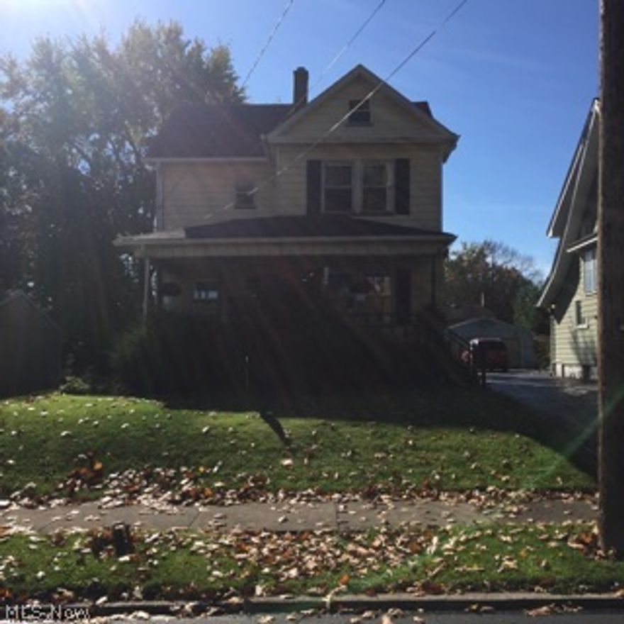 Outstanding 3 bedroom aluminum sided two story features beautiful antique wood woodwork and hardwood floors and doors, living room, formal dining room, kitchen with all appliances, nice 3 season back porch plus front porch, updated bathroom, windows, furnace, electrical and more.  2 car garage.  A must see!