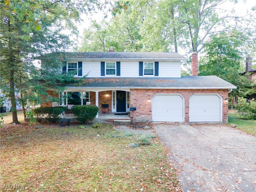 Welcome to this spacious 4 bedroom, 2 ½ bath Colonial home in the heart of Westlake, in the sought-out “Musical Street” area. This home greets you with a charming front porch and gleaming hardwood floors as you enter.  The bright and airy living and dining rooms offer the perfect combination for entertaining family and friends. The large eat-in kitchen flows into the family room with a classic wood-burning stone fireplace. The family room, kitchen and dining room all overlook the back yard retreat, complete with large wooden deck. This main floor also has a convenient half-bath. Upstairs, the primary suite boasts a walk-in closet and an en-suite bathroom, with walk-in shower. The three additional bedrooms are generously sized and share a full bathroom — ideal for children or guests. The full basement houses the laundry area. The large 2 ½ car attached garage offers plenty of extra storage space. The neighborhood features a park and pool — part of the sought-after West Ridge Estates, conveniently located near Crocker Park and the Westlake Rec Center. Schedule your private showing today.