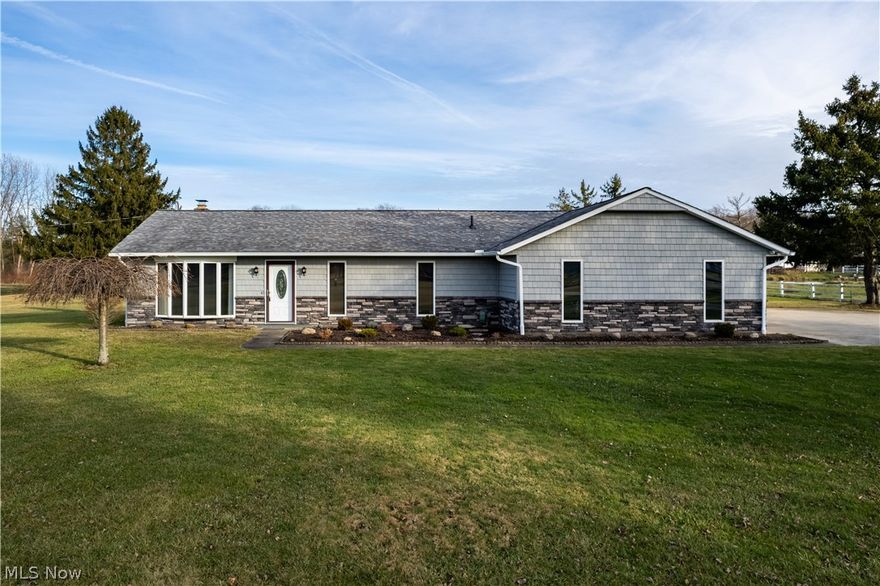 Welcome to this beautiful ranch home located in Buckeye School District. Located on an impressive 3 and a half acres this 3 bedroom & 2 bathroom home is immaculate!  MASSIVE Outbuilding is heated with a 220 line and provides great space for a workshop, car enthusiast, outdoor equipment and more! The front of the home has been updated in 2022 with new shake siding and stone adding the curb appeal.  Opening the front door you are greeted by the foyer opening up into a modern open floor plan consisting of the great room with wood burning fireplace, dine in kitchen with center island, and access to the back patio.  Kitchen boasts large ceramic tile flooring, granite counters & backsplash, stainless appliances and more! Off the kitchen is a large butler's pantry for additional storage and entertaining guests!   Down the call is a master bedroom including a master bath and a wall of closets!  Off the hallway is a second full bathroom and a giant great room acting as a fantastic second living