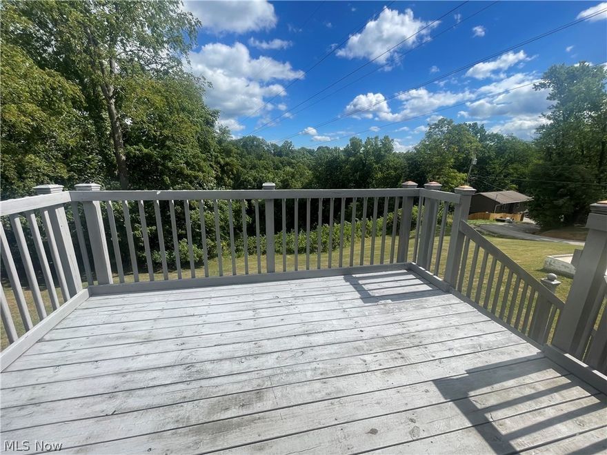 Super Split Foyer located on 1/2 Acre Corner Lot just Outside the city limits.. Check out this 3 Bedroom. 1 1/2 Bath, Updated Oak Spacious Kitchen, Updated Bathroom, Beautiful Back Deck with Panoramic Views.. This property has a full  Walk Out Basement featuring a Family Room, Game Room with built in Bar/with stools and a 1 car garage!!  Call Today to View before its GONE!!