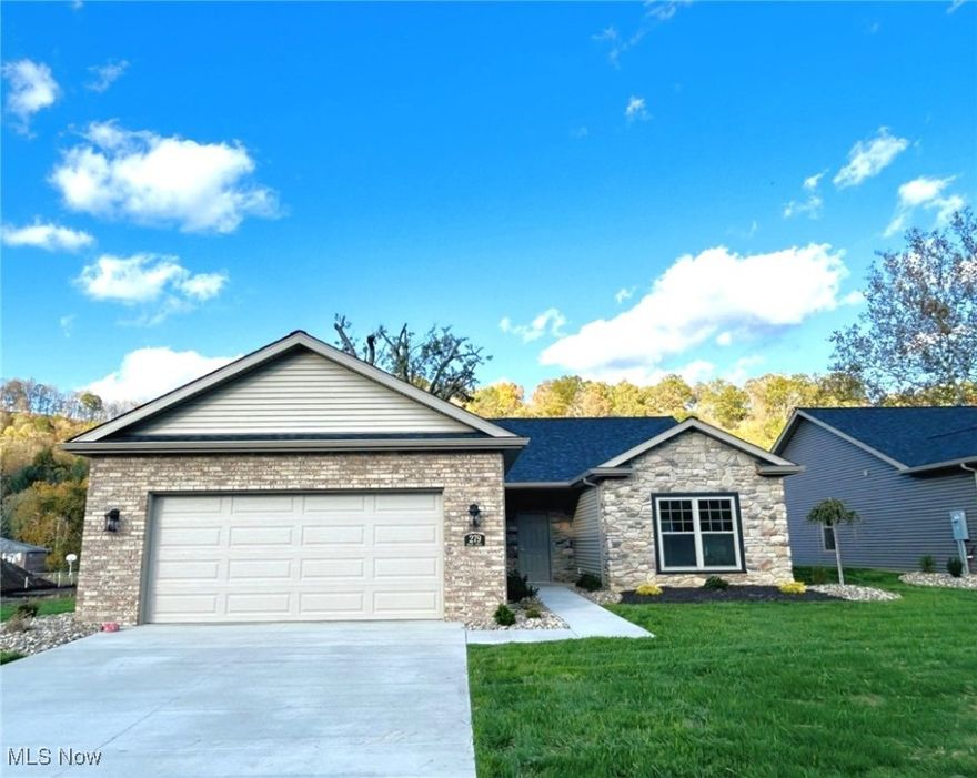 Welcome to easy, one level living in this brand new 2 bedroom, 2-bath home located in desirable St. James Gate community! Step inside to an open floor plan with soaring 9-foot ceilings that create a bright spacious atmosphere. The stunning kitchen is a true highlight, featuring a large pantry, beautiful cabinetry, an island with granite countertops, and plenty of space to cook and entertain. The primary suite is a relaxing retreat with a walk-in closet, double vanity with granite counter tops, and a luxurious walk-in shower. A second bedroom and full bath offer flexibility for guests, hobbies or a home office. Enjoy morning coffee or peaceful evenings on your patio surrounded by nature. The two-car garage with attic storage adds convenience and ample space for all your needs. Located just minutes from Rt. 22 and only 25 minutes to Pittsburgh International Airport, this home offers the perfect blend of comfort and convenience. Don't miss your chance to own a new home in one of Weirton's most sought- after neighborhoods.