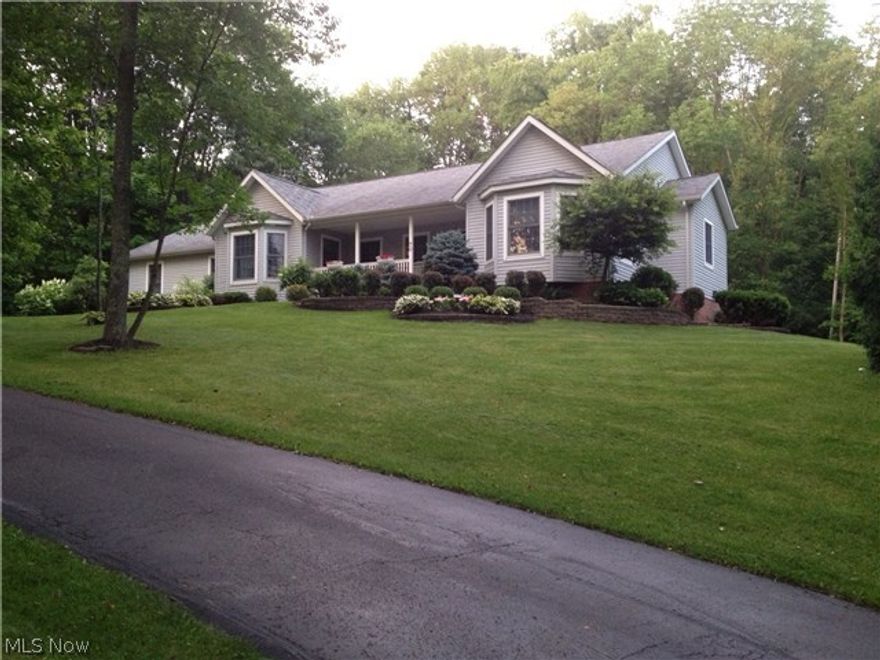 Truly, truly Beautiful Ranch with lots of Character and Wonderful Upgrades & Finishes sits on Four Lots...Definitely A WHOA Home !!!  Custom Cherry Kitchen  designed & crafted by SCHROCKS of Walnut Creek w/ bullnose accented countertops. Lovely Bay-Windowed Eating Area highlights the kitchen. All Kitchen appliances stay for the new proud owner.
Beautiful Cherry stained woodwork package & Cherry-stained Hickory Hardwood Flooring in Foyer, Great Room, Kitchen & Dining Room. The lot is private and gloriously laid out w/ lovely landscaping throughout.
Winding blacktop driveway circles into the property to allow terrific privacy even though the home is on Buckhorn right near the lakefront. The curb appeal as you drive up the driveway will certainly catch your eye...especially the comfy Front Porch.
Master Suite features a jetted tub and separate shower and appointed wall-in closet. Part of the enormous basement is finished. There is a 700sqft garage at the back of the house & yard shed.