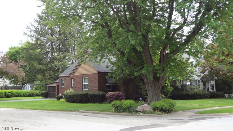 Off the market for a short time to remove wallpaper, repaint, install new flooring in kitchen, install new glass block windows and more maintenance. Now ready for new buyers. Quality built 3 bedroom, 1.5 bath all brick bungalow is on a corner lot not far from Arrowhead Golf! Easy access to I-77. Warm wood paneling and nice built-ins in the large second downstairs bedroom that could be used as a den. Hardwood flooring under neutral carpeting in dining room and living room. The second floor bedroom is large enough for several beds and has a half bath that could easily be made into a full bath. There’s a knotty pine rec room rec room in the basement with a decorative fireplace. Recently replaced windows, refrigerator and garbage disposal. Washer and dryer included. Attached to the garage is a carport that becomes a screened patio when the screens are dropped down from the ceiling this spring. If that’s not enough, a one year home warranty is included.