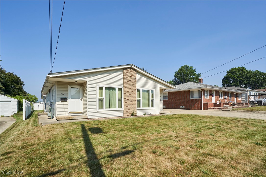 Side-by-side duplexes for sale. Each unit has two bedrooms, a kitchen, a living room and a full bath, all on the first floor. There is a two-car detached garage for each unit to have a parking space. The back parking area has ample space for additional cars, grills, and patio furniture. There is a full basement with each unit having access to its own washer and dryer hook-up with storage or additional finished living space. The exterior has been very well maintained with vinyl windows and great curb appeal. One unit is currently rented. 600-602 Hillman Rd needs to be sold as a package w/594-596 Hillman Rd. Unit 594 has the main shut-off valve for the water in each unit. See MLS 5139794.