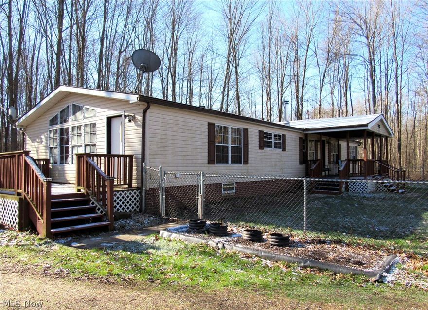 Here is a nice almost 5 acre property with a 3 bedroom/2 bath home with several outbuildings in a beautiful country setting. The options are many with oversized 2 car garage with electric, a newer 24' x 30' barn/workshop with 220 amp electric, propane & wood-burner heat. There are also a 12' x 16'and a 12' x 40' buildings. This nice home has hardwood flooring in the living room, kitchen, dining room, and there is a gas fireplace in the living room, and a wood stove in the adjoining room. The home  features a nice front porch for you to relax with your morning coffee. There is also a nice deck for you to enjoy. The nice big front lawn has chain link fence for your pets or kids to roam, and exercise in. Behind the house is a nice back yard going to the wooded area in the back. Some of the timber was harvested last year, which leaves you with plenty of firewood for your enjoyment or to sell as camp firewood.  Come take a look, and make your move on this move in ready home before it's gone.