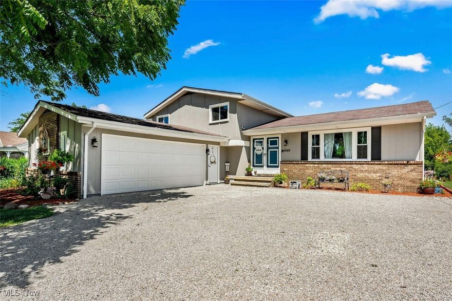 Combine glamour and practicality in this stunningly renovated split level home located in Brunswick Hills.  The main level has been tastefully upgraded to an airy, open concept featuring an abundance of white cabinetry complemented by efficiency windows provide plenty of natural light throughout the home while contributing to lower energy costs.  Neutral new flooring is featured throughout the entire home, including the second level which provides 3 spacious bedrooms with classy ceiling fixtures and a totally remodeled bathroom boasting vanity with double sinks and granite countertops, stylish tile bath and conveniently located linen closet.  The lower level does not disappoint with a sophisticated wall to wall brick fireplace. new sliding glass patio door, additional capacious bedroom suite with tile shower and granite countertop.  Efficiency remains consistent with a new furnace/air conditioner 2021, hot water tank, water softener 2024, sump pump and garage door with new opener. Brand new roof installed August 2025! Thought and convenience extend to the outdoors where relaxation can be enjoyed in the private expansive backyard on the new brick patio, while taking advantage of the fenced in area and new shed providing ample amounts of extra storage.  Benefits continue in Brunswick Hills with NO CITY TAX!