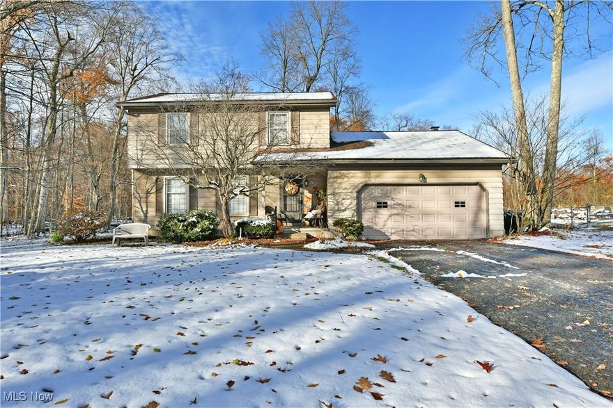Private, scenic and filled with comfortable charm, this endearing Liberty home has everything you’ve been looking for! Tucked away in a quiet corner along a dead-end extension, this residence takes full advantage of the wrapping, nearby tree line to create a unique and serene setting. Take in the views from the prominent rear deck as you watch the leaves change and the snow fall. Warm, natural colors comprise the exterior for an earthy and engaging feel. Step inside as the welcoming foyer reveals a carpeted staircase and short hall that passes by the spacious living room. Here, hardwood styled flooring continues around the corner and into a graciously appointed formal dining room where you can enjoy a tasty, home-cooked meal. A large serving window gets it to the table faster as you peer into the adjacent kitchen, delighting with its ample footprint that includes eat-in-dining space. Cherry colored cabinetry adds to the allure. Around the corner, a lovely half bath awaits the entrance to a daring rear family room, wrapped in stained wood paneling and showcasing a towering brick mantle with its inset fireplace. Sliding glass doors allow for instant rear deck access. Upstairs, a sizeable full bath graces the landing while the main hall transcends a trio of bright and colorful bedrooms; each with hardwood flooring. Laundry service and storage is located at the basement level.
