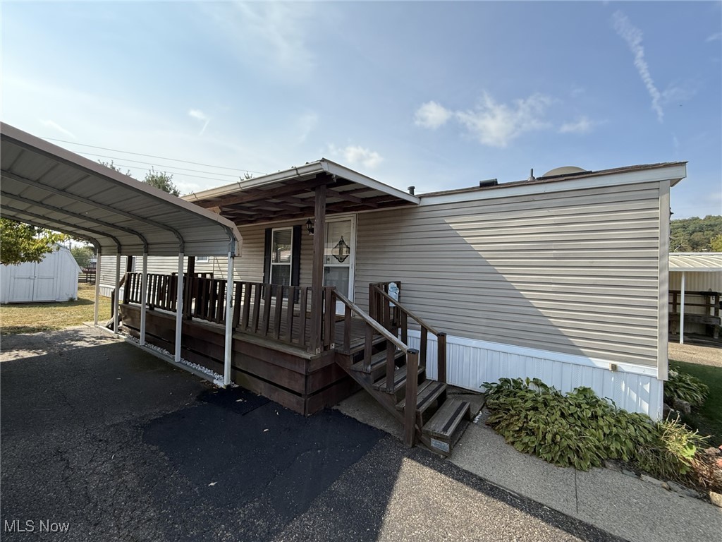 Here is your chance to live near it all, in a quiet, stress free environment enjoying life. This 2 bedroom, 2 bath manufactured home is now available. Featuring a large kitchen and living room that just feels like home, 2 large bedrooms and a private bath in the master, a separate laundry area, this home is perfect for easy living. Outside you have a nice size yard with a shed for storage, a carport and large deck. Call today for a showing.
