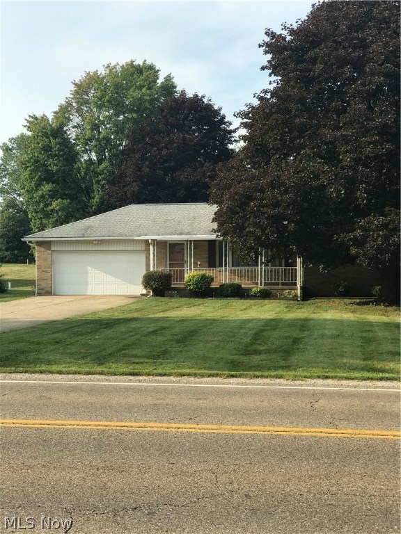 Well-maintained all brick ranch on over ½ acre awaits your personal touches. Glass block windows in the full basement which includes B-Dry w/Lifetime Warranty. The 40 x 25 basement provides additional 1,000 sq. feet, including a finished Rec Room and 11 x 14 finished room with a closet (previously used as a 4th bedroom). Hardwood flooring beneath the carpet in the large living room and 3 bedrooms. Updated kitchen features: Kemper wood cabinetry with dovetailed joints and easy close drawers; dishwasher; ceramic stove; refrigerator; microwave (new 8/18) and ceiling fan. Dining Room slider leads to 4-Season Sun Room (heated) with direct access to the enormous backyard with mature shade trees. 14 x 12 shed on concrete pad with double door entry and loft storage. Attached 2 car garage is 23 x 20 w/keypad opener and man door access to both the side and back yards. 40 gallon Rheem gas H2O heater new in 1/18. Updated 100 amp service; Microban acrylic tub; Aprilaire humidifier; ceiling fans. Co