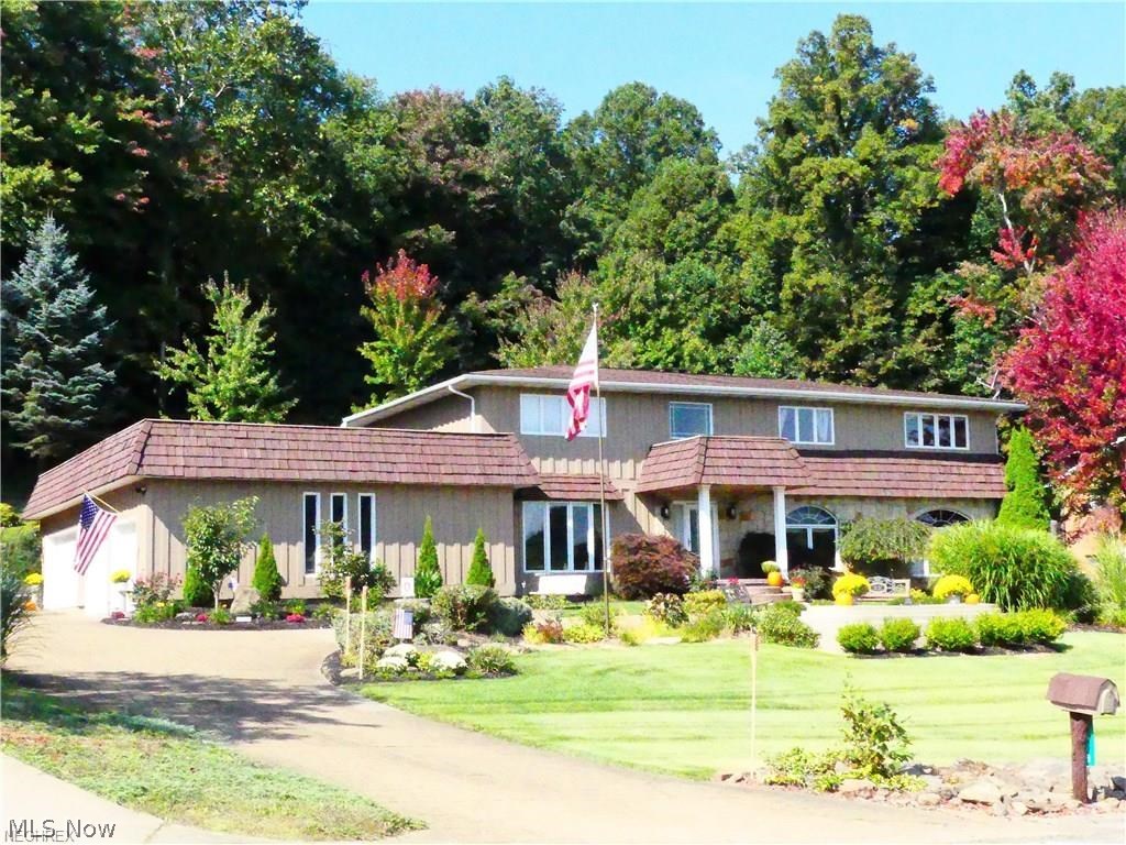 Gorgeous and spacious lake house with fabulous lake views and situated in a phenomenal area close to front gate and golf course. This 4BD 5BA offers wonderful space for entertaining along with an additional living/in-law 1st floor suite. Stunning kitchen with plenty of cabinets, island, eating bar, double ovens, and more. Distinguished dining room, huge great room with cathedral ceiling, detailed solid wood doors and woodwork throughout. Master suite with magnificent bonus/office/man cave room. Heated 4 car garage with beautiful newer doors and staircase to lower level. Beautiful landscaping everywhere! Enjoy party time out front by the fire pit and panoramic views of the lake or host a fun social event in the privacy of the large and lovely back patio area. Lake Mohawk is a private gated community with a golf course, 3 beaches, water skiing, boating and year-round fishing! Immediate possession. Don't miss out on lake living at it's best!