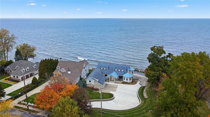 Nestled along the shores of Lake Erie, this spectacular Bay Village home offers over 8,000 square feet of living space with a blend of comfort, style, and lakefront serenity. Featuring its own private beach and a view of the Cleveland skyline from the water’s edge, the property is set far back from the road for a true sense of privacy and quiet, paired with incredible lake views from nearly every room. The main level features an open layout with walls of windows, a spacious great room and dining area beneath coffered ceilings, and a lakefront kitchen with a curved peninsula and bar seating—perfect for everyday living or entertaining. Off the living room, a glass-railed deck overlooks the water, creating a seamless connection between indoor and outdoor living. A custom wet bar and a full wall of built-in cabinetry add both style and function to the main living area. The owner’s suite is also on the main level and includes a spa-like bath, walk-in closet, and bonus room surrounded by 180-degree lake views. A first-floor office overlooks the water, and a laundry room, two powder rooms, a mudroom, and a three-car garage complete the main level. Upstairs, two additional bedrooms each offer lake views and access to a shared deck and full bath. The lower level adds nearly 4,000 square feet of flexible living space, featuring two large recreation areas with views of the water, a sunroom, storage space, and stairs leading directly to the beach and water. Conveniently located near the Metroparks, local shops, restaurants, and highway access, this home combines lakefront living, privacy, and luxury in one truly remarkable Bay Village property available for lease.