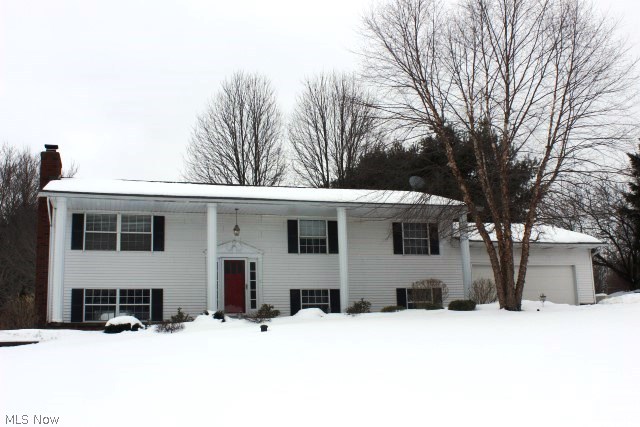 Absolute move in! Pretty soft contemporary on quiet street with 3-4 bedrooms, 2.5 baths, approx. 2178SF & numerous updates* Bright & light open floor plan--Neutral decor* Foyer with ceramic floor* Updated eat in kitchen with breakfast bar, desk, stainless appliances, ceramic back splash & updated bathrooms- all with ceramic floors* Formal dining with access to spacious deck across back of home* Master bedroom with private bath, fan & access to deck* Lower level family room with stone wall fireplace with built in wood burner & heatilator, dry bar with ceramic floor & access to paver patio* 4 bedroom/craft room or office with built in wrap around work center* 1/2 bath lower level* 2 car attached garage (26' deep) with updated opener & service door* Covered front porch* Built in stone fire pit* Water feature* Storage barn* Newly painted* Updated light fixtures* Shingles (2000)* Heat pump approx. 5-6 yrs old* All electric home- approx. budget per electric company $138/mo (review in 3 month