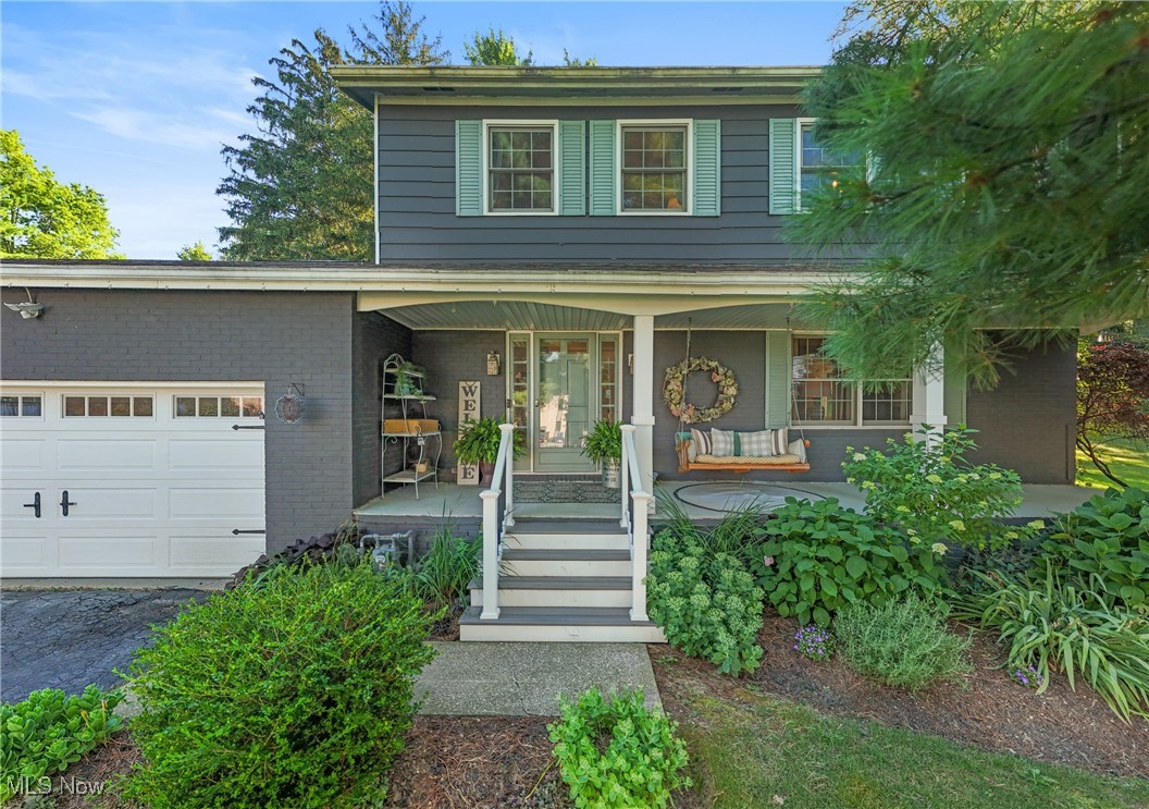 Charming inside and out! This updated home features a covered front porch, classic white picket fence, and a spacious great room with wood-burning fireplace. The kitchen and bathrooms have been recently renovated, and the waterproofed basement offers extra space and peace of mind. Step out back to a beautifully designed paver patio with a built-in fireplace—ideal for entertaining or relaxing year-round. Conveniently located in Macedonia with easy access to I-271, I-480, and the Turnpike and close to parks and shopping,