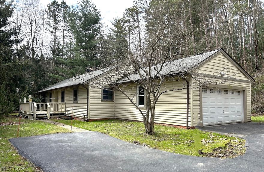Cozy Ranch, set back on 2.45 wooded acres, located on a cul-de-sac street for added privacy. Hardwood floors and wood paneling highlight this home.  The kitchen was upgraded with hickory cabinets, and a Dinette area with a built-in hutch. Relax in your sprawling Living Room with wood floors, stone fireplace and a wood burner to keep you cozy warm in the winter.  Wall of windows brings you into the natural surroundings.  Alas, it does need some TLC.  Great Location, close to freeways and shopping.