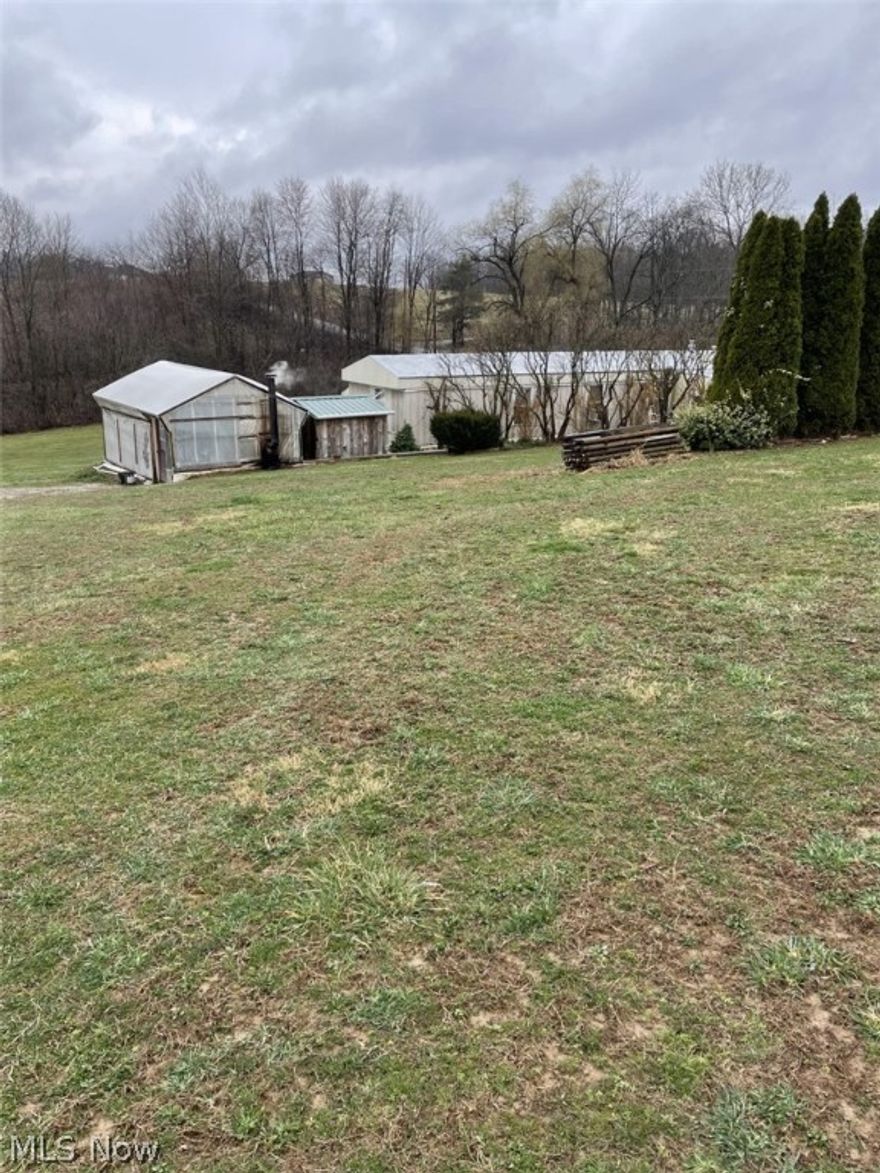 If your looking for acreage, tillable land, wooded area and greenhouses then this single wide manufactured home is what your looking for. Located on the property are 30 x 96 and 12 X 20 greenhouses, both have wood burning furnaces in them for heat. The home also features a exterior wood burning furnace for utility free heat. Contingent upon seller locating suitable housing. Mineral rights will not transfer.