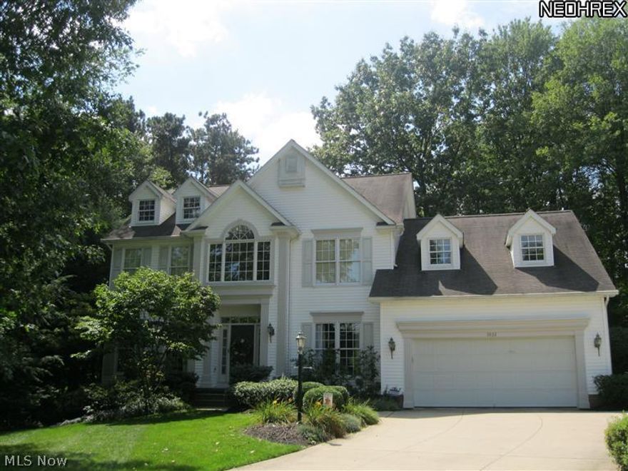 Beautiful Wooded Setting on cul-de-sac! 2720 sq ft w/approx 1000 sq ft finished in walkout lower level. Two Story foyer entry with hard wood flooring flowing through to living room/office, ½ bath and kitchen. Updated kitchen with soft close, light cabinets, granite counter, center island, stainless-steel appliances and sliding door to deck. Kitchen is open to the family room with fireplace and a wall of windows overlooking wooded lot. Laundry room and back office complete the 1st floor. Upstairs you have 3 large bedrooms, main bath and master suite with his and her closets, double sink vanity and whirlpool bath. The walkout lower level is nicely finished with large open family room wired for surround sound, wet bar with built in cabinetry, beverage and wine refrigerators. 5th bedroom/office and roughed in full bath waiting for your finishing touch!  New sliding door being installed walks out to the lower level patio with walk way to deck. New roof 2020. Listing agent is owner.