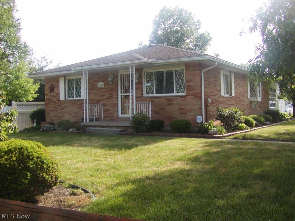 Beautiful, well maintained brick ranch on 65' by 165' manicured lawn. This home really shows pride of ownership from the immaculate condition to the wonderful wood floors in most rooms. Large bright living room, newer applianced kitchen and dining area with bay window. Basement recreation room plus extra room for office, media room or computer room. Glass block windows in the basement. Home also has replacement windows. Relax in your cheerful sunroom or enjoy Summer days on your patio surrounded by a bright white privacy fence great for entertaining. America's Preferred Home Warranty also included.