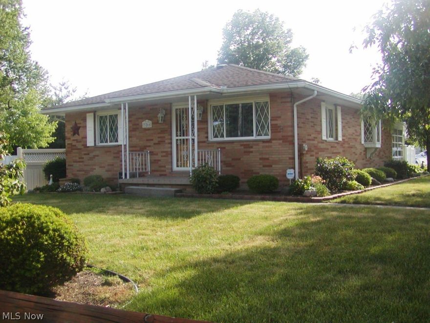 Beautiful, well maintained brick ranch on 65' by 165' manicured lawn. This home really shows pride of ownership from the immaculate condition to the wonderful wood floors in most rooms. Large bright living room, newer applianced kitchen and dining area with bay window. Basement recreation room plus extra room for office, media room or computer room. Glass block windows in the basement. Home also has replacement windows. Relax in your cheerful sunroom or enjoy Summer days on your patio surrounded by a bright white  privacy fence great for entertaining. America's Preferred Home Warranty also included.