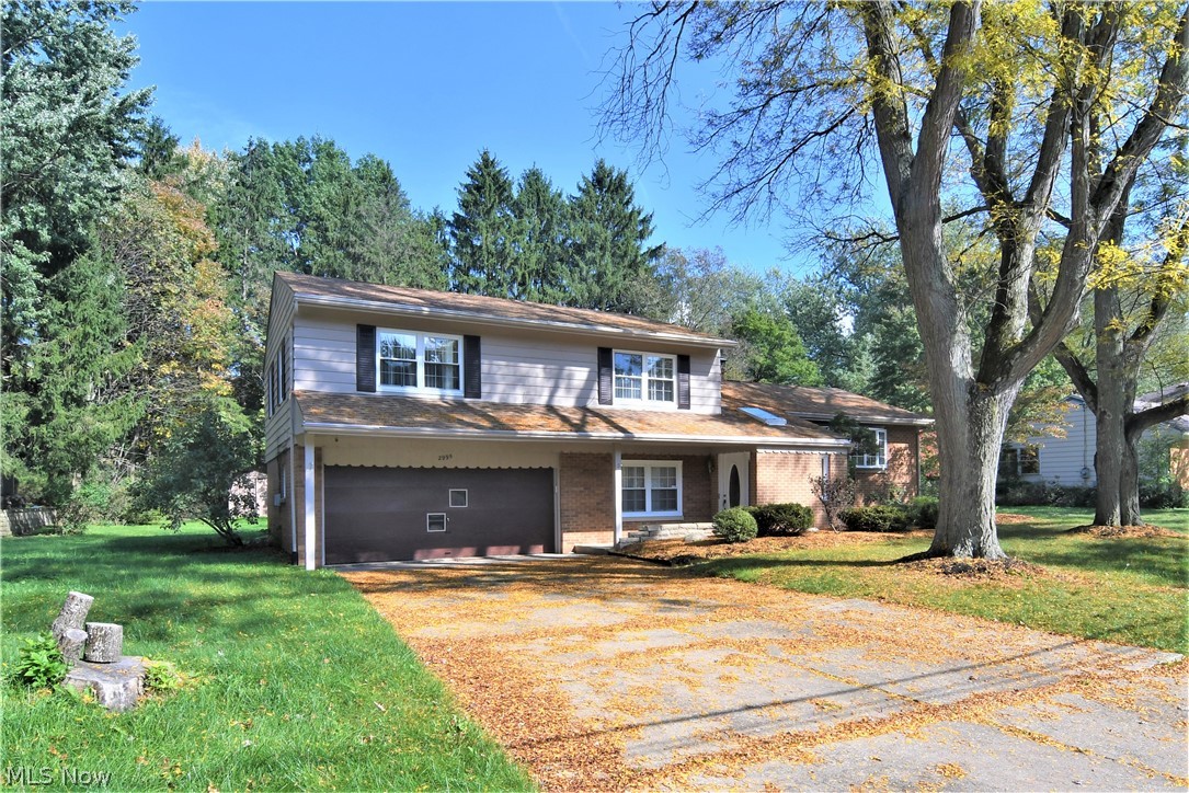 Come see this beautiful brick split level home in the heart of Fairlawn. With over 2,900 sq ft of living space, 4 bedrooms and 3 baths, everyone will have plenty of room to enjoy. The freshly painted dine-in kitchen, formal dining room, and living room with impressive fireplace all combine to make the perfect space to entertain friends and family. Serve cool drinks from the bar in the rec room or watch a movie in the spacious family room. New roof & A/C in 2016 and new carpet in 2018. Located in the A+ rated Copley-Fairlawn school district and close to many amenities including: Bicentennial park, Griffiths park, tennis courts, ample shopping and Fairlawn Nature Center. Call today for your private showing!