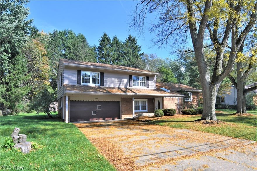 Come see this beautiful brick split level home in the heart of Fairlawn.  With over 2,900 sq ft of living space, 4 bedrooms and 3 baths, everyone will have plenty of room to enjoy.  The freshly painted dine-in kitchen, formal dining room, and living room with impressive fireplace all combine to make the perfect space to entertain friends and family.  Serve cool drinks from the bar in the rec room or watch a movie in the spacious family room.  New roof & A/C in 2016 and new carpet in 2018.  Located in the A+ rated Copley-Fairlawn school district and close to many amenities including: Bicentennial park, Griffiths park, tennis courts, ample shopping and Fairlawn Nature Center.  Call today for your private showing!