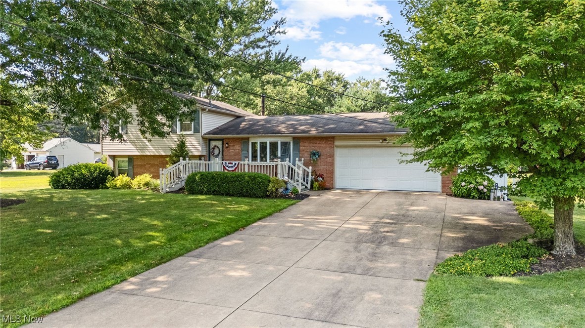 Impeccably maintained split-level home in desirable Bordner Estates, in Nimishillen Township. This one-owner brick and vinyl-sided gem sits on a half-acre lot in a low-traffic neighborhood, just 12 minutes from Belden Village’s shopping and dining. Perfect for entertaining and everyday living, the home boasts high-end finishes throughout such as genuine hardwood floors. Enter via the front deck into a friendly living area on the main level. The gourmet kitchen shines with custom cabinets, pull-out pantry drawers, and a built-in cutting board. The upper level features three spacious bedrooms, a full bathroom, and a convenient linen closet.The lower-level recreation room, with exposed beams, a wood/electric fireplace, and a top-tier wet bar with mini fridge, is ideal for gatherings. A sliding door opens to a brick patio with pergola, overlooking a serene backyard. A half bathroom adds convenience. The basement offers a finished room, laundry area with sink, sump pump, and glass block windows for natural light. The concrete driveway accommodates RV or trailer parking, adding versatility. This move-in-ready home blends timeless charm with modern upgrades, perfect for creating lasting memories. Schedule a showing today!