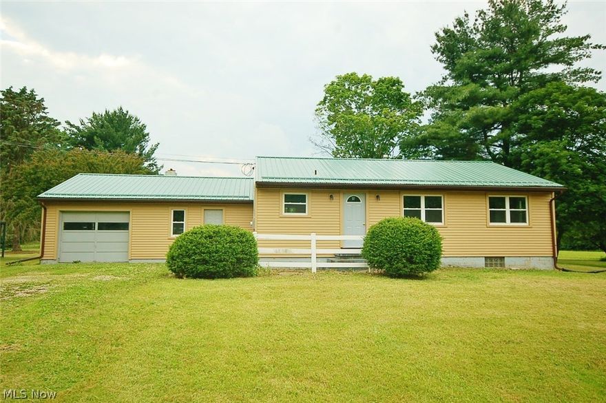 Immediate Possession! Located on over 1.4 private acres, this 3 bedroom, 1 bath (plus one roughed in) ranch has a lot going for it! Remodeled kitchen with new Kraftmaid cabinets! New metal roof! New siding! New windows! New flooring! Remodeled bath! Fresh paint! One attached and one detached garage. Maplewood schools.  Seller will escrow $15,000 for any Repairs or Replacement required by the TCHD.
