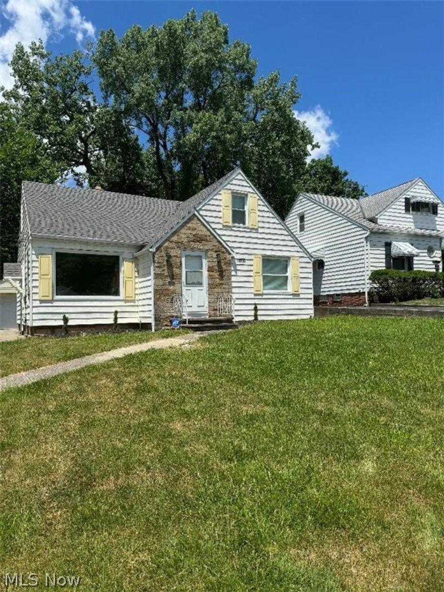Well kept three bedroom bungalow on a desirable Garfield Heights street.  Main floor features two bedrooms down with full bathroom, eat in kitchen and living room.  Main living space offers beautifully rich dark brown hard wood flooring.  Bathroom is spacious and has been professionally ceramic tiled with neutral colors that blends with natural tones of the home.  Third bedroom on second floor offers hardwood floors and spacious layout  This Home will be move-in ready and awaiting you! All appliances will remain Stainless steel Refrigerator, Gas stove and washer and dryer.  Point of sale is to be scheduled property will be violation free.