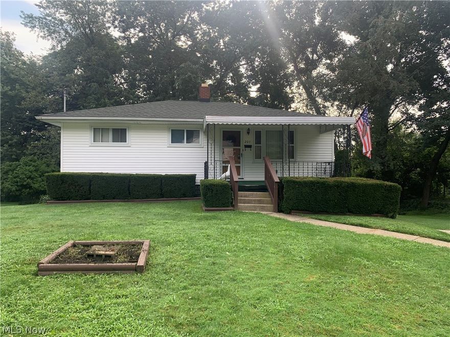 This charming, well-maintained Ranch is nestled on a double lot on the quiet backstreet of Goodview Ave. A beautiful picture window welcomes tons of natural light, filling the living space. To the right, the living room opens into the adorable eat-in kitchen which houses lovely wooden cabinetry. Down the hall, you’ll find an updated full bath with a laundry chute & three nicely sized bedrooms. The master bedroom & one of the guest bedrooms feature beautiful hardwood floors. Throughout the entire home you will experience natural light shining through all of the wood windows. You will find a spacious rec room w/built-ins and a large laundry area in the partially finished walk-out lower level. Enjoy relaxing on the covered front porch or in your wooded backyard. Only minutes from Goodyear Park! Move-in ready but also ready for your own personal touches. Welcome home!