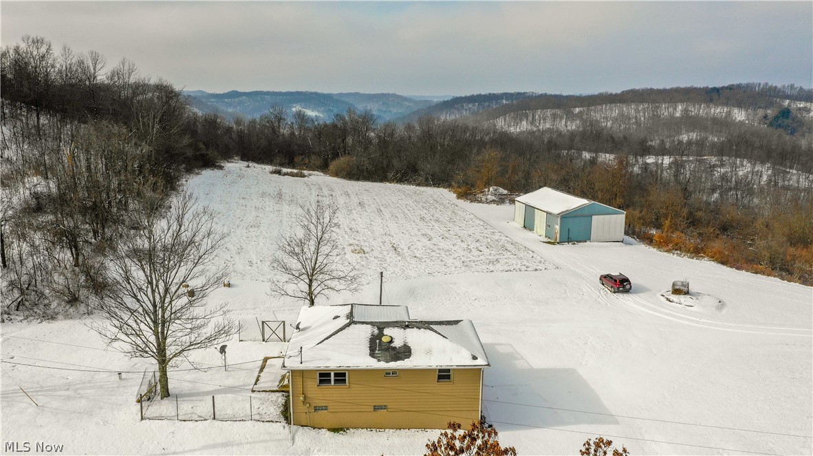 Auction: 3/16 A wonderful southern Tuscarawas county farm with excellent remodeled home and good pole building. The land features ½ mile of road frontage, mostly wooded with parcels ranging in size of 5 to 20 acres. There are trails throughout. The home was completely remodeled and features 3 bedrooms, full bath, kitchen, living room on the main floor with a full walkout basement with laundry room and bathroom. Utilities include gas forced air heat, central air, well & septic. The building is 30’x50’ and offers equipment storage. Gas & oil rights have been previously withheld and do not transfer. Whether looking for wooded hunting land, building sites, or a really good home, join us for this great early spring auction.
Parcel 1: 17.1 Acres w/ 579’ frontage. Includes the ranch home & barn. Excellent homestead.
Parcel 2: 20.5 Acres w/ 686’ frontage. Mostly wooded land. Great Hunting.
Parcel 3: 17.5 Acres w/ 476’ frontage. Mostly wooded land. Great Hunting.
Parcel 4: 13.5 Acres w/ 210