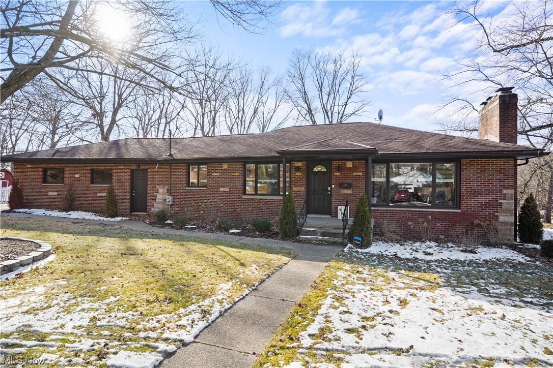 Beautiful Brick Ranch on 1/2 acre in a lovely well maintained Akron neighborhood. The floor plan is open and light and bright. The first floor has been updated with Luxury Vinyl floors and new light fixtures throughout. The living room has a large bay window and white wood burning fireplace accentuated with shiplap. The impressive kitchen has attractive cabinets with some open shelving, a stainlees steel farmhouse sink and a large pantry with sliding barn door. There are three generous sized bedrooms and a beautifully updated full bath. The lower level has a 42 x 14 nicely finished rec room with a second fireplace, a laundry room and a utility room.
Outside you'll find a circle driveway a 2 car attached garage and large fenced area plus a shed.